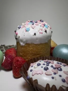 Easter cake with white icing and sprinkles Stock Photos