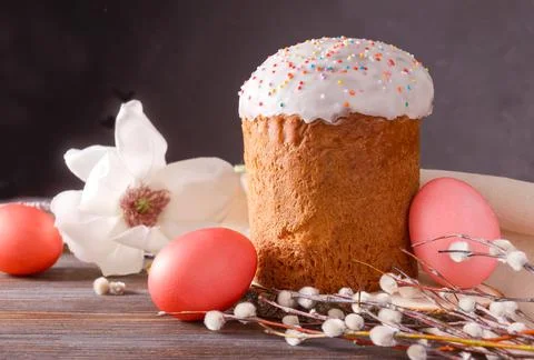 Easter cake with willow twigs and 3 red eggs, magnolia flower, Stock Photos