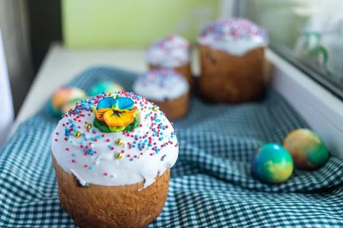 Easter cake with willow twigs and blue , lilac eggs on a dark background Stock Photos