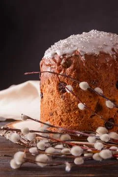 Easter cake with  willow twigs, light napkin on dark background Stock Photos