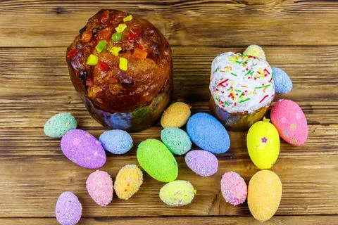 Easter cakes and easter eggs on a wooden table. Top view 写真素材