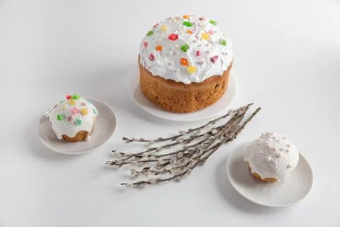 Easter cakes with willow branches on a white background. Stock Photos