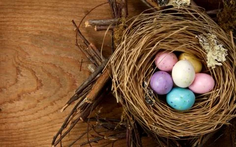 Easter candy in a nest Stock Photos