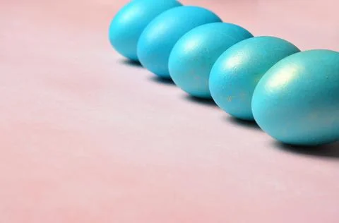 Easter card. Blue Easter eggs on a red background. Stock Photos