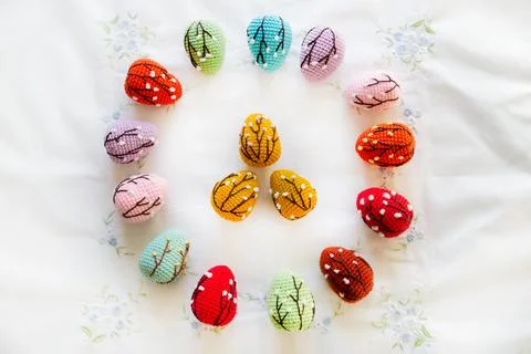 Easter card with colored crocheted eggs. Easter holiday banner Stock Photos