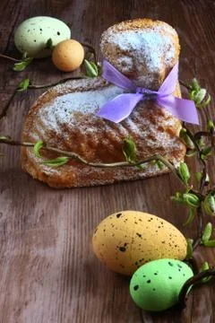 Easter card / easter lamb cake with purple ribbon, four easter eggs and willow s Stock Photos