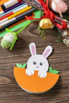 Easter card gift Easter bunny on a wooden table. Handmade. Project of child.. Stock Photos