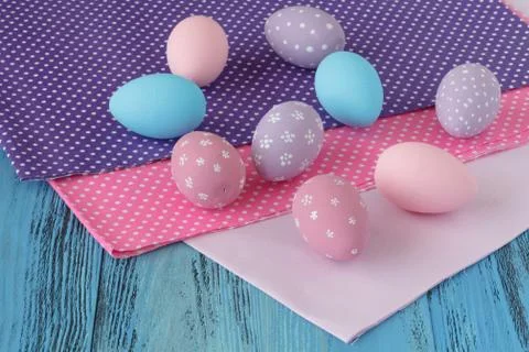 Easter celebration with colored eggs and festive cloth Stock Photos