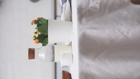 Easter celebration concept. Easter eggs, bottle of milk, flowers in white pot on Stock Footage 268744032