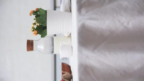 Easter celebration concept. Easter eggs, bottle of milk, flowers in white pot on Stock Footage 268744094
