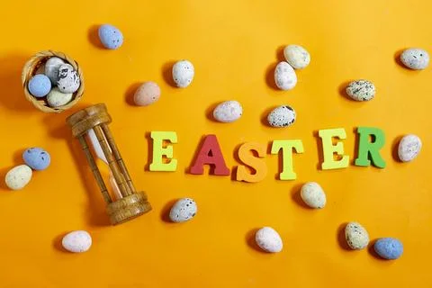 Easter celebration concept featuring painted decorative eggs, themed letters spe Stock Photos