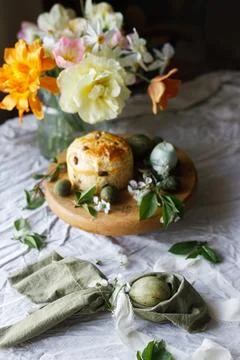 Easter celebration. Stylish green easter eggs in bunny ears napkin, easter .. Stock Photos