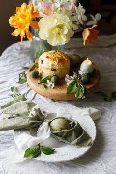 Easter celebration. Stylish green easter eggs in bunny ears napkin, easter .. Stockfoto's