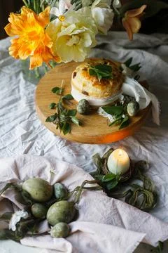 Easter celebration. Stylish green easter eggs, easter bread, candle and che.. Stock Photos