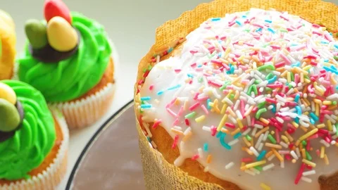 Easter ceramic bunny and cupcakes with sweet colorful eggs Stock Footage 128577409