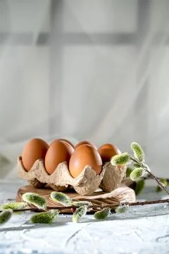Easter chicken eggs on the table and willow,  cultural traditions Stock Photos