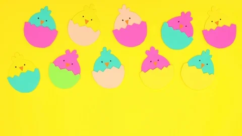 Easter chickens in egg appear on yellow background - Stop motion Stock Footage 124351232