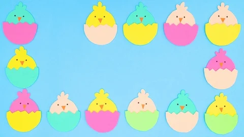 Easter chickens in egg making frame and blinking on blue background- Stop motion Stock Footage 124350698
