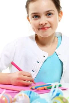 Easter-child  decorates eggs  Stock Photos