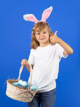 Easter to the child. Happy easter holidays. Cute little child wearing bunny ears Stock Photos