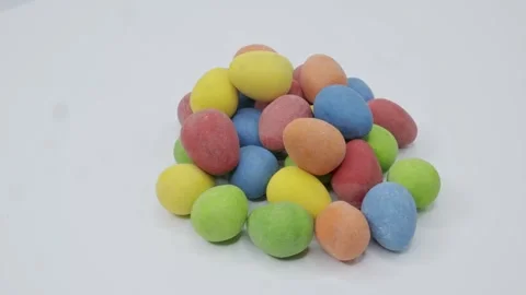 Easter Chocolate Blue Green Red Yellow Orange Turning Stock Footage 304396349