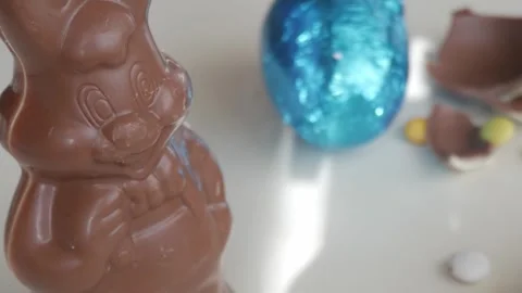 Easter Chocolate Bunny and Foil Egg Capture Holiday Spirit and Joy Stock Footage 332944205