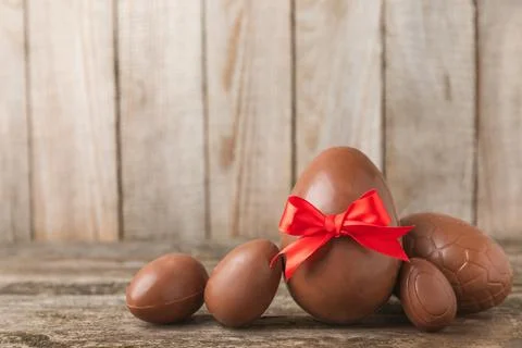 Easter chocolate egg on textured background. Stock Photos