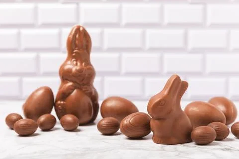 Easter chocolate egg on textured background. Stock Photos