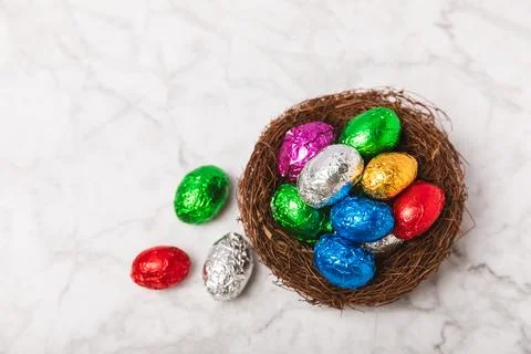 Easter chocolate egg on textured background. Stock Photos