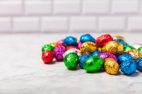 Easter chocolate egg on textured background. Stock Photos