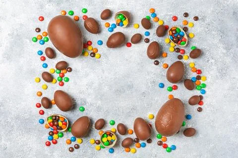 Easter chocolate egg on textured background. Stock Photos