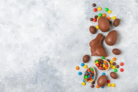 Easter chocolate egg on textured background. Stock Photos