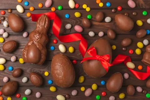 Easter chocolate egg on textured background. Stock Photos