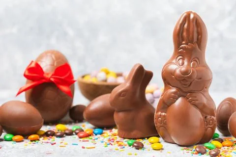Easter chocolate egg on textured background. Stock Photos