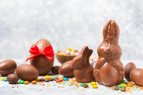 Easter chocolate egg on textured background. Stock Photos