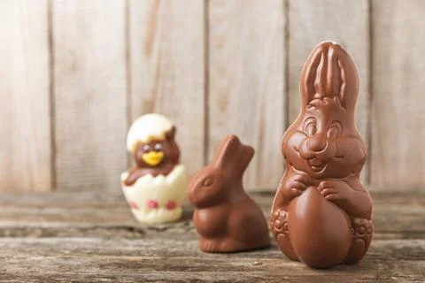 Easter chocolate egg on textured background. Stock Photos