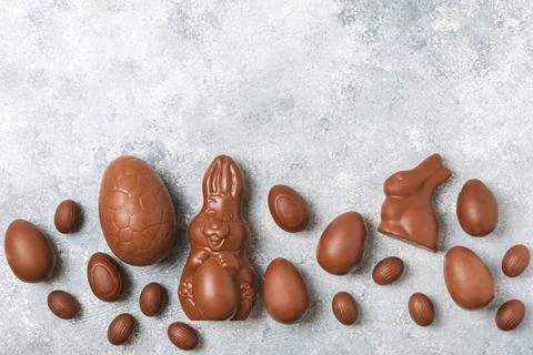 Easter chocolate egg on textured background. Stock Photos