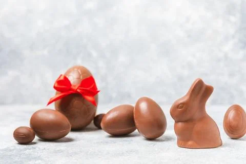 Easter chocolate egg on textured background. Stock Photos