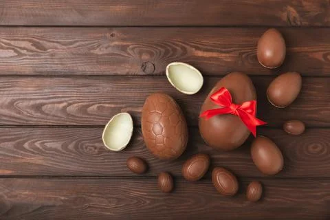 Easter chocolate egg on textured background. Stock Photos