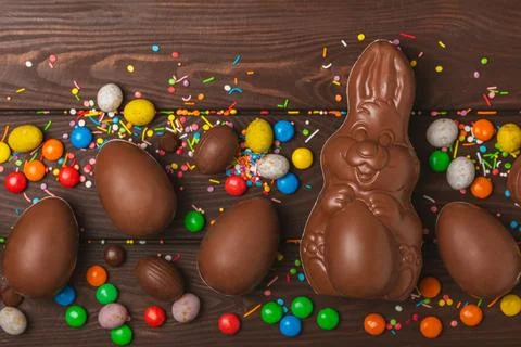 Easter chocolate egg on textured background. Stock Photos