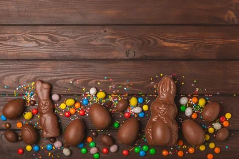 Easter chocolate egg on textured background. Stock Photos