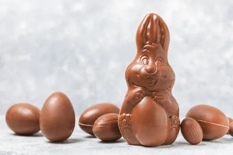 Easter chocolate egg on textured background. Stock Photos