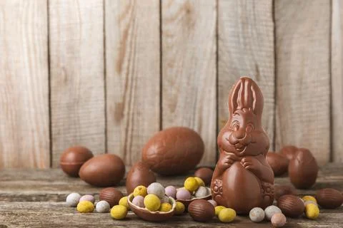 Easter chocolate egg on textured background. Stock Photos