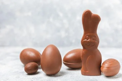 Easter chocolate egg on textured background. Stock Photos