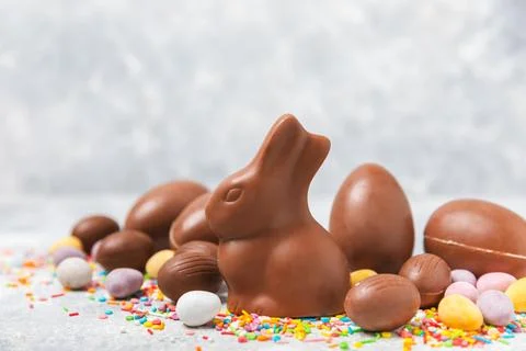 Easter chocolate egg on textured background. Stock Photos