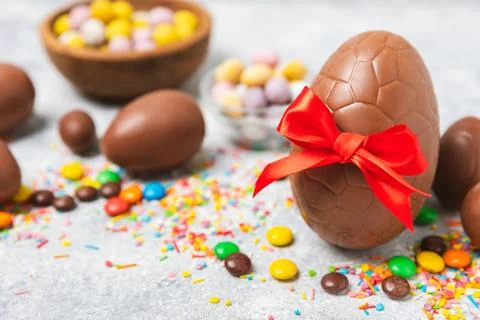Easter chocolate egg on textured background. Stock Photos