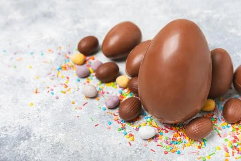 Easter chocolate egg on textured background. Stock Photos