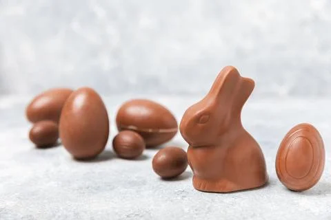 Easter chocolate egg on textured background. Stock Photos