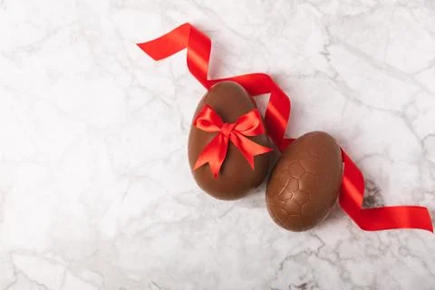 Easter chocolate egg on textured background. Stock Photos