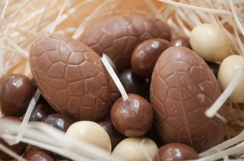Easter chocolate eggs in a nest Stock Photos